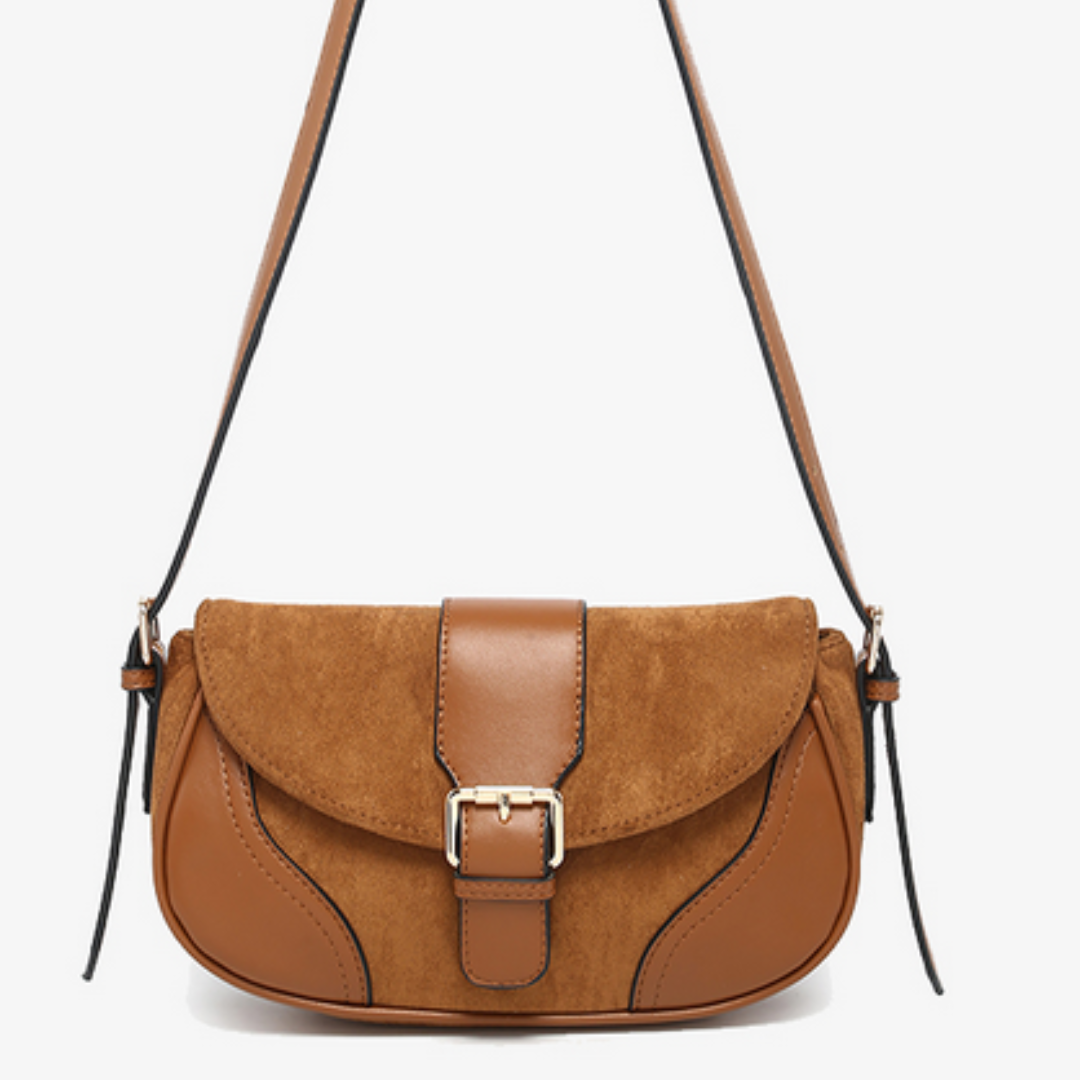 Brown suede handbag with a gold buckle on a white background