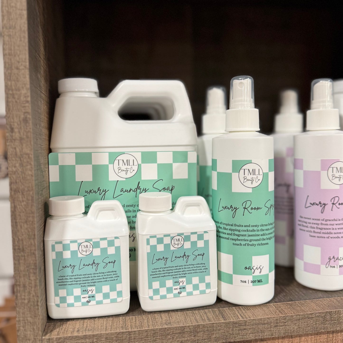 Collection of Oasis luxury products on a wooden shelf