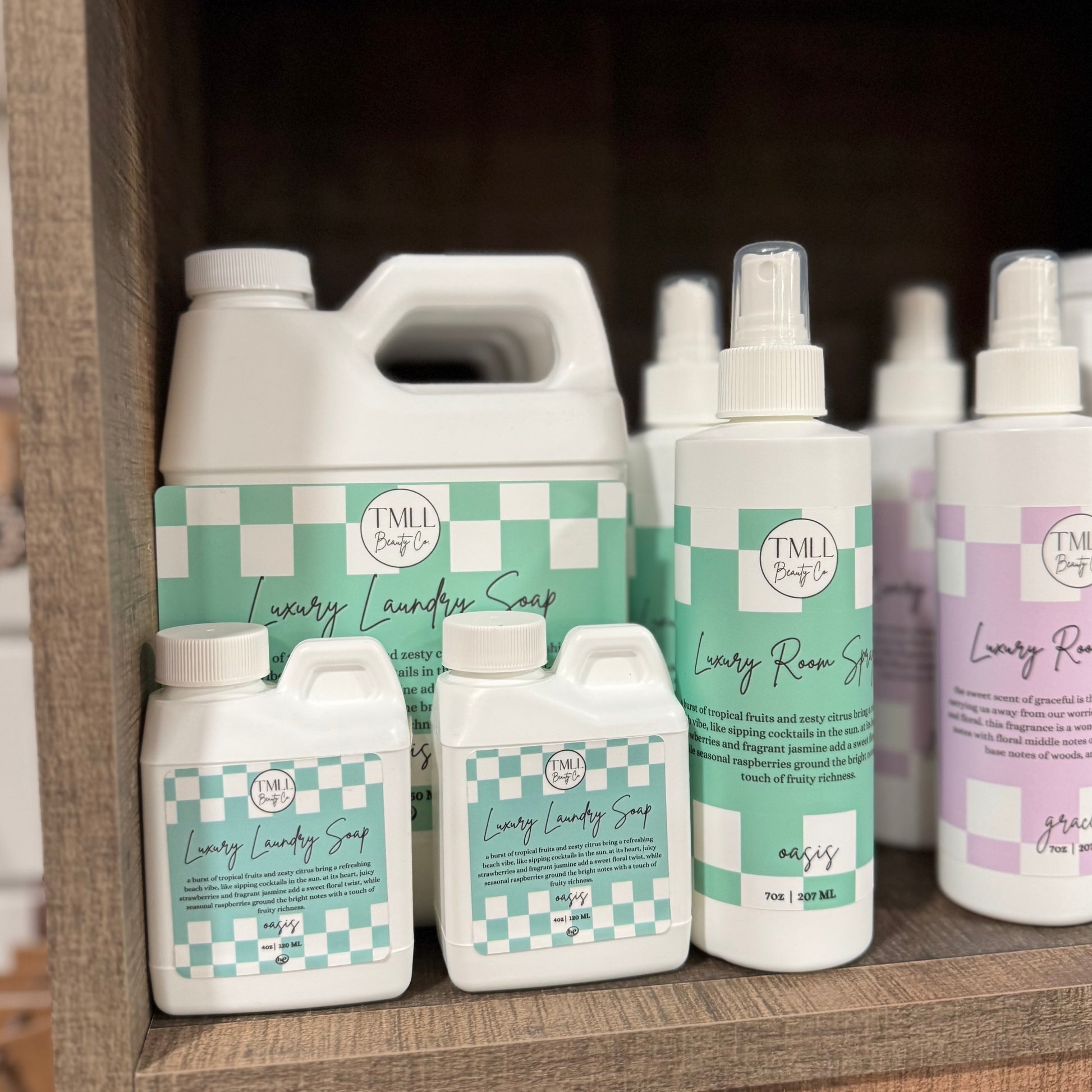 Collection of Oasis luxury products on a wooden shelf