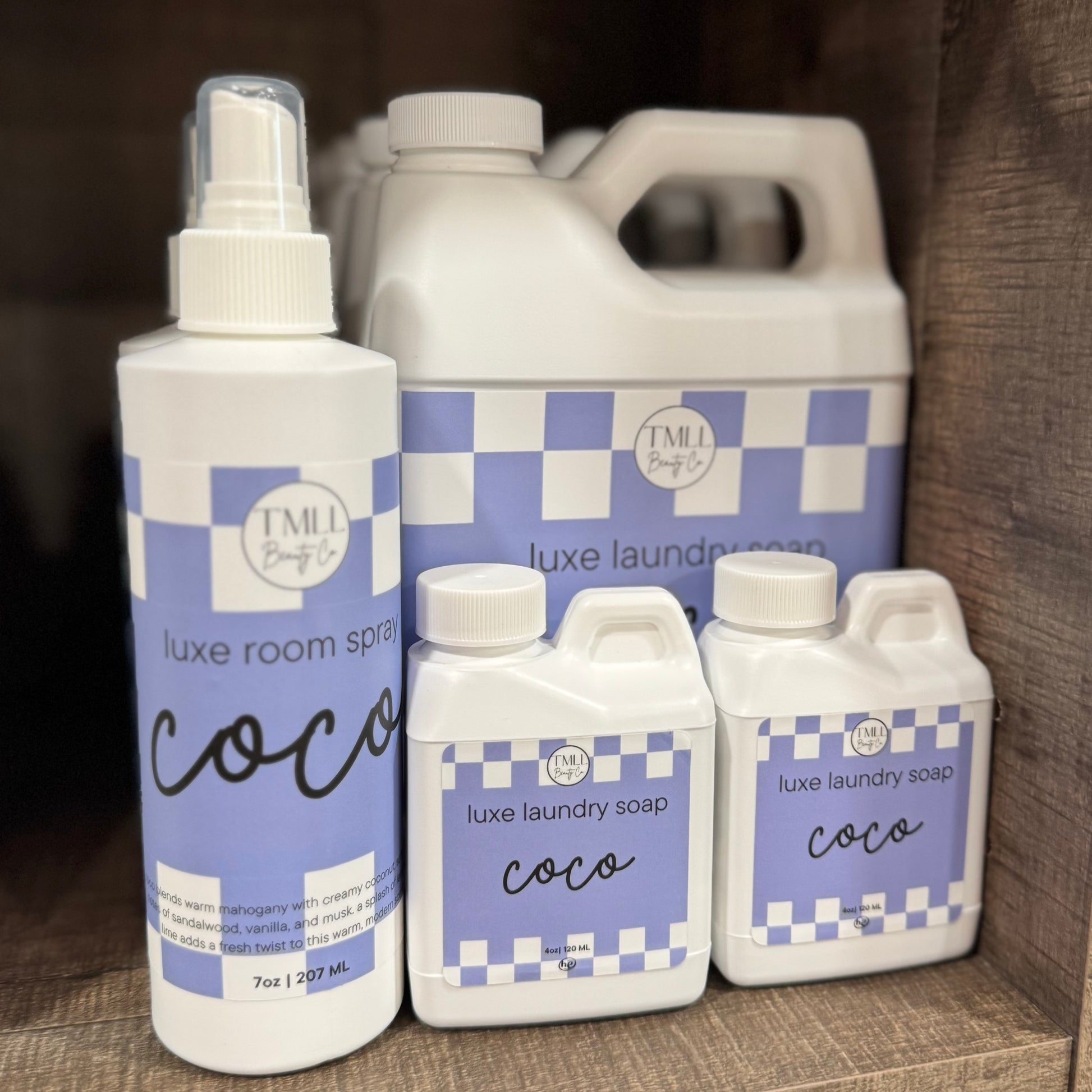 Collection Coco scent laundry and room spray products with checkered labels.