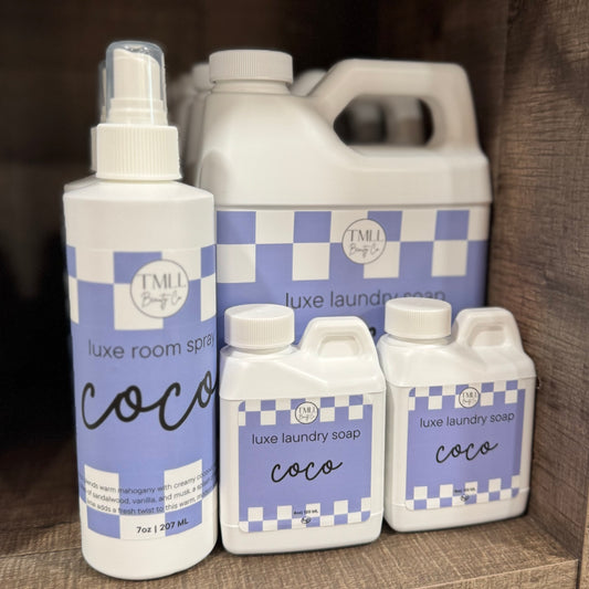 Collection Coco scent laundry and room spray products with checkered labels.