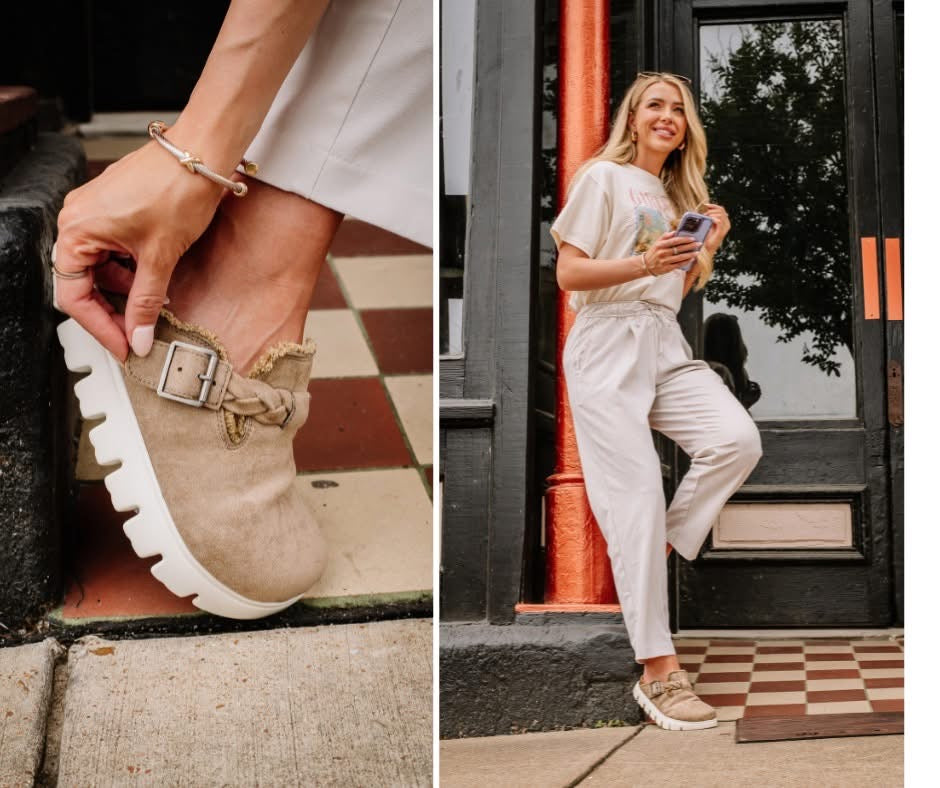 Close-up of a sandal with a buckle and a person wearing a beige outfit in an urban setting.
