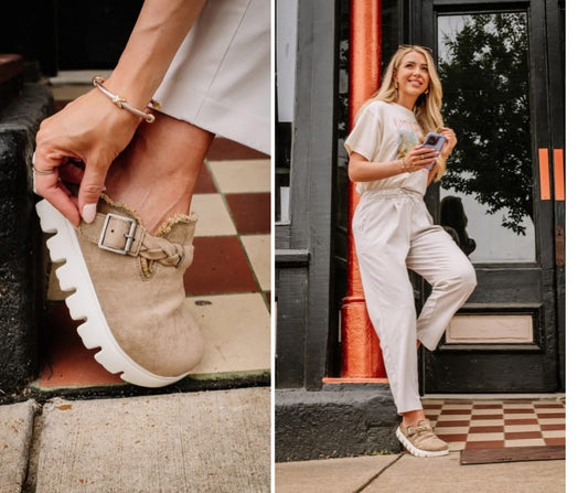 Close-up of a sandal with a buckle and a person wearing a beige outfit in an urban setting.